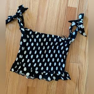 The cutest black polka dot crop top with bow tie sleeves